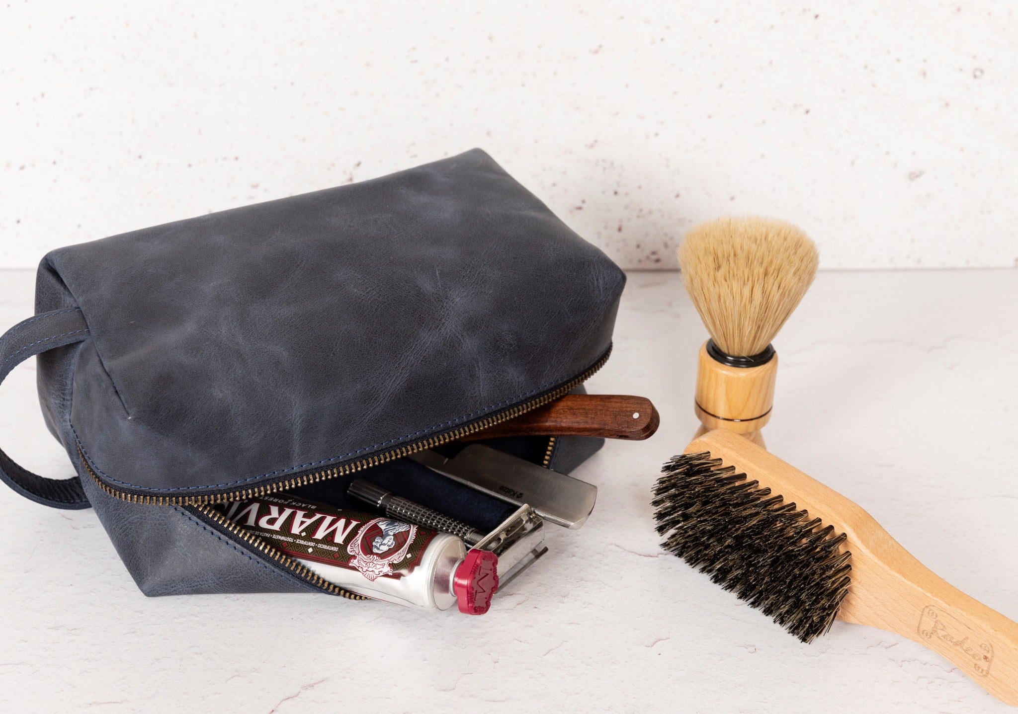 Gym Themed Dopp Kit • Leather Toiletry Bag • Custom Gift - The Lush Gifts - Gym Themed Dopp Kit • Leather Toiletry Bag • Custom Gift - The Lush Gifts - The Lush Gifts - a travel bag with a brush and other items - Customized Leather Gift - Personalized Leather Gift