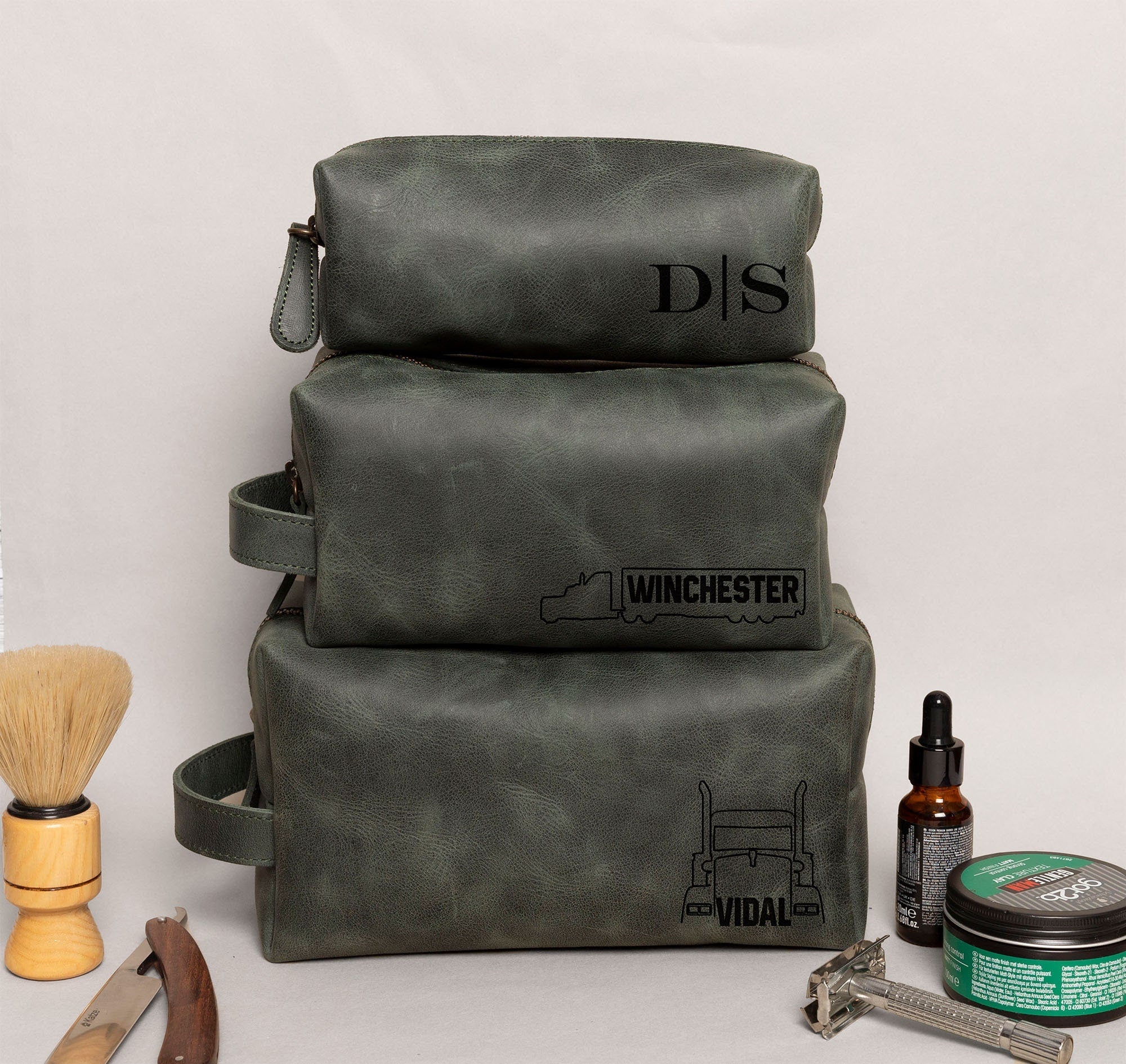 Semi Truck Themed Dopp Kit • Leather Toiletry Bag • Custom Gift - The Lush Gifts - Semi Truck Themed Dopp Kit • Leather Toiletry Bag • Custom Gift - The Lush Gifts - The Lush Gifts - a couple of bags sitting on top of a table - Customized Leather Gift - Personalized Leather Gift